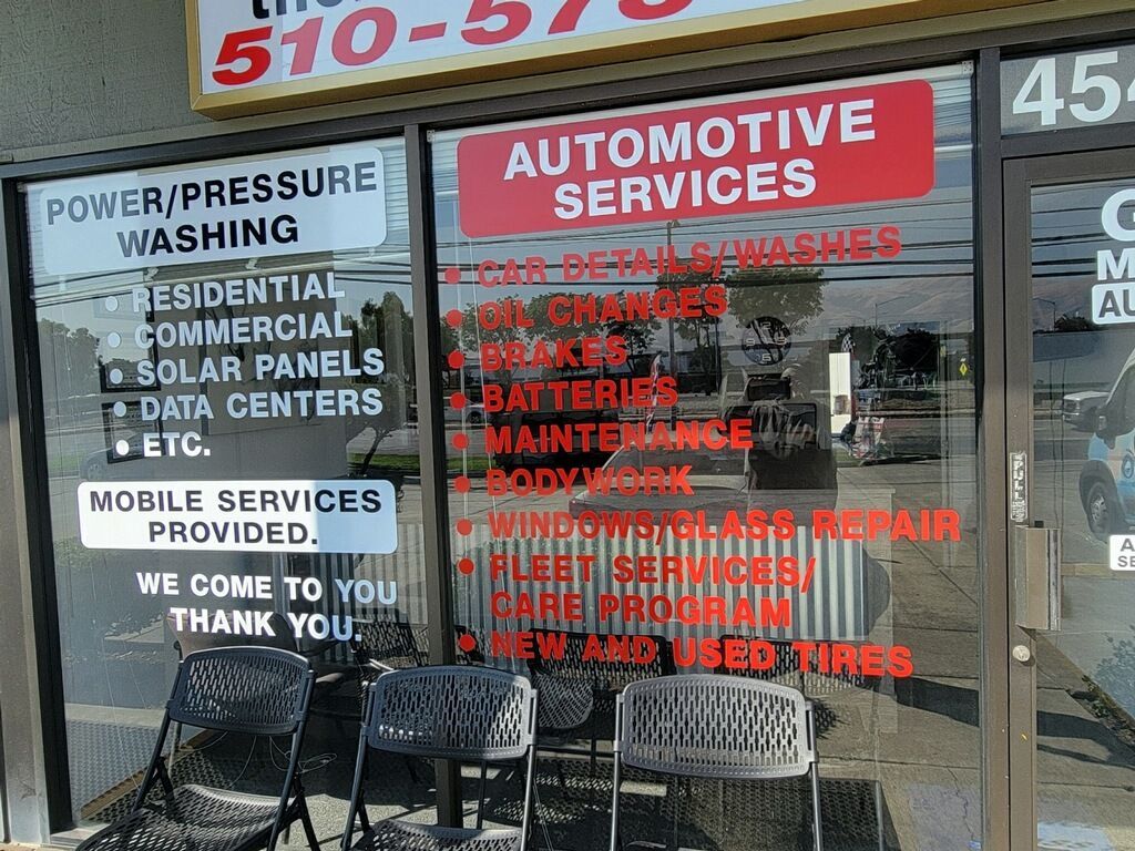 A store front with a sign that says automotive services