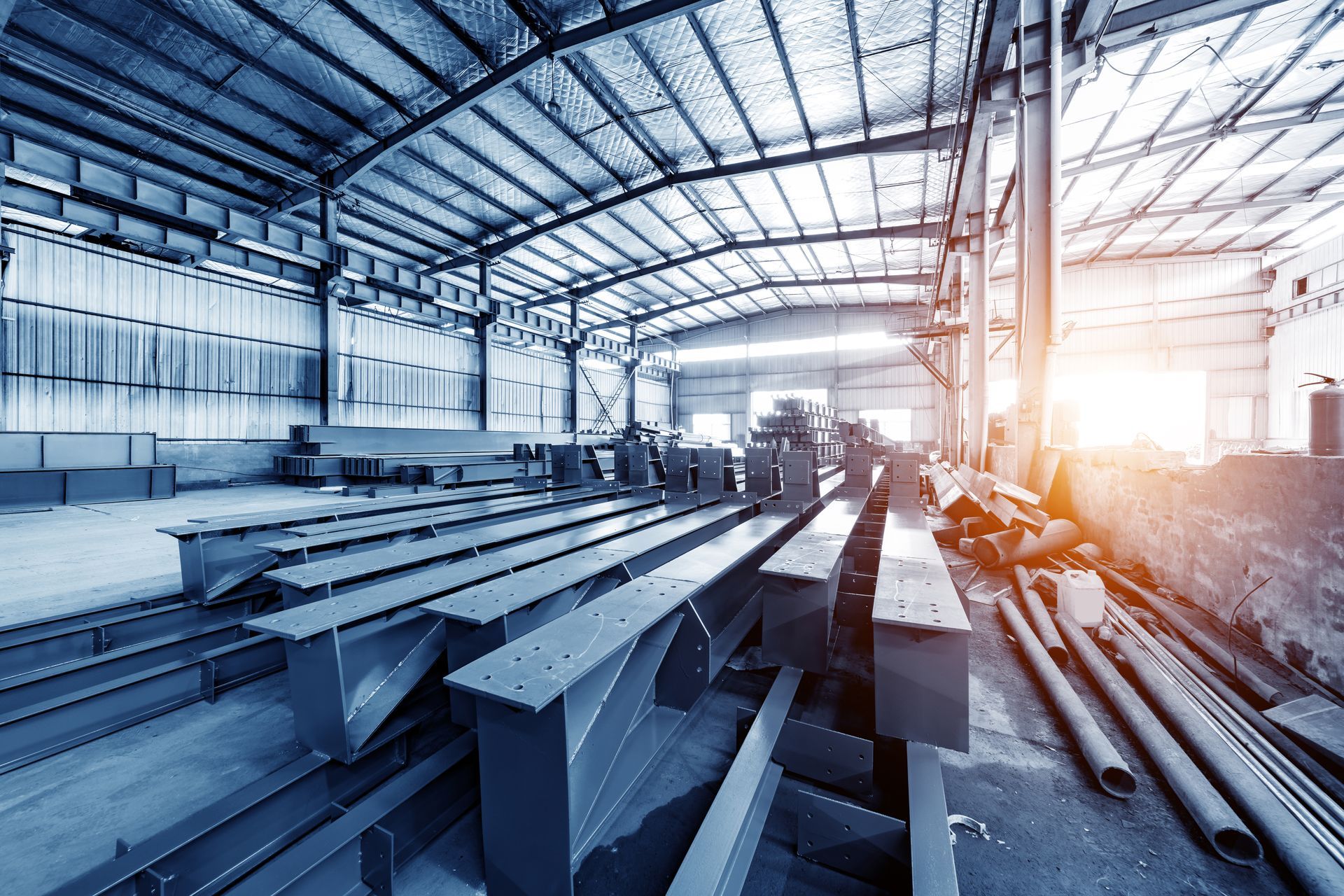 Picture of a steel fabrication company floor stacked with a lot of steel