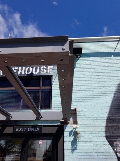 Steel awning over an entry door with 