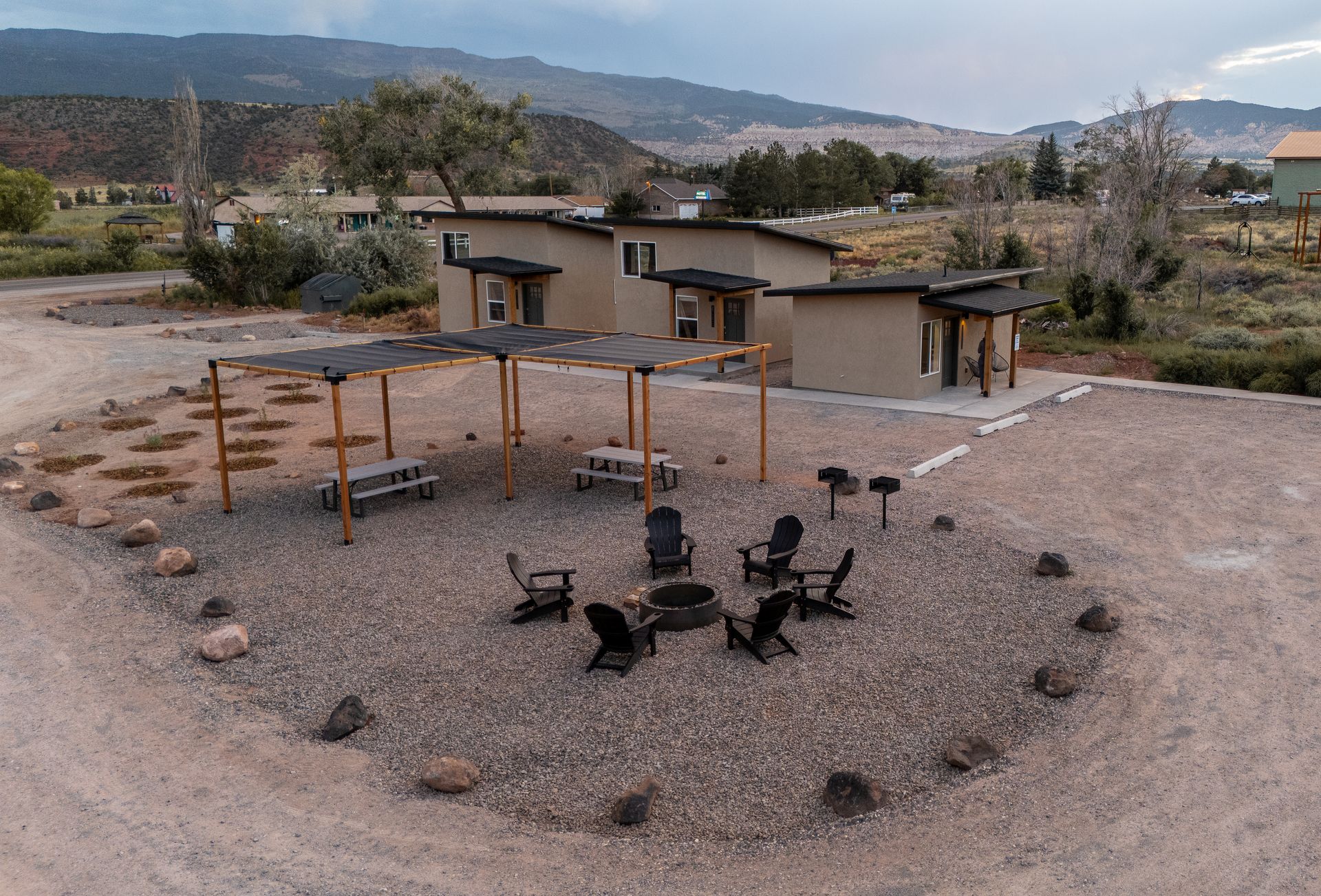 An aerial view of a fire pit in front of a house.