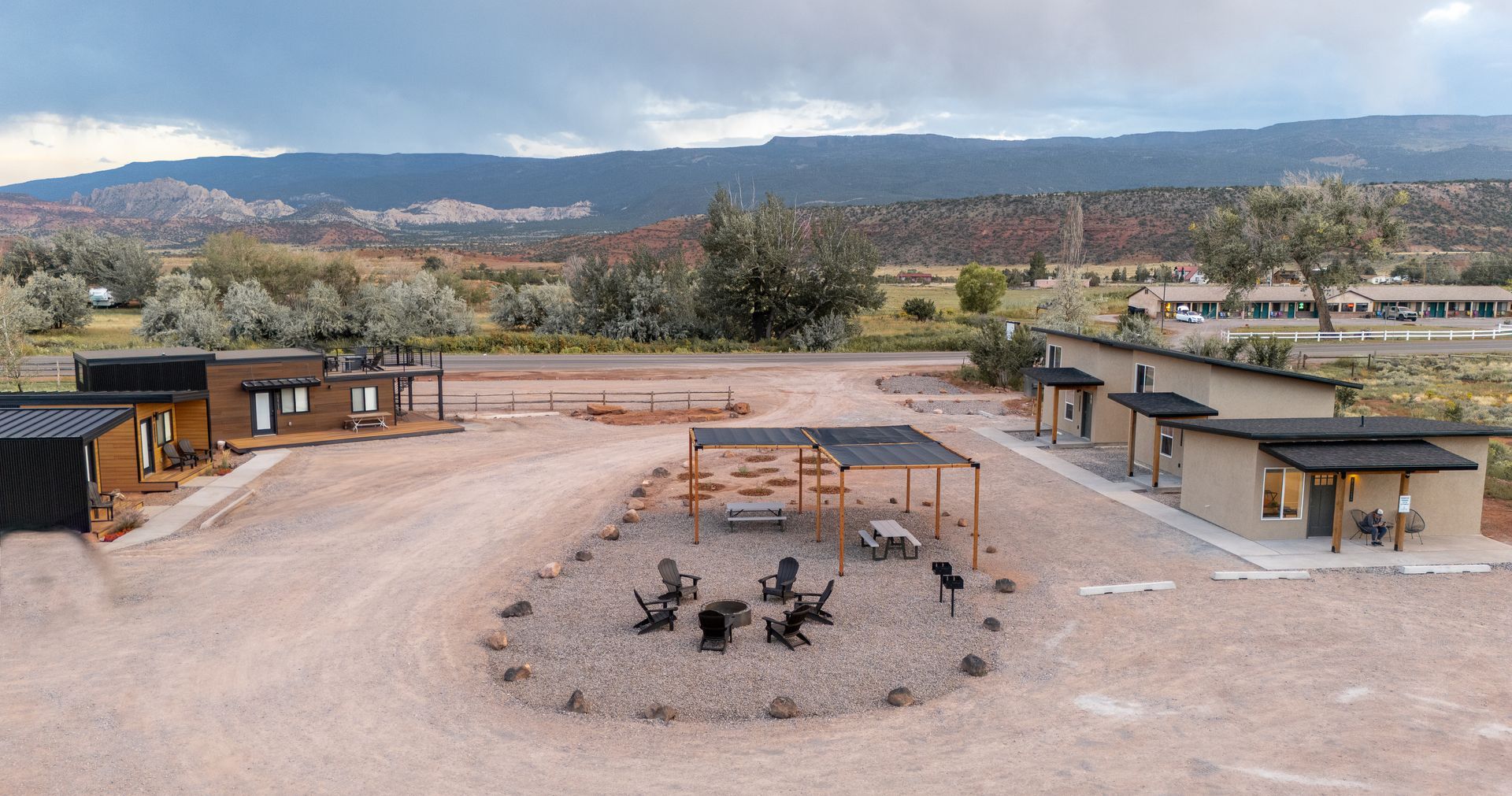 An aerial view of a house with a fire pit in the middle of it.