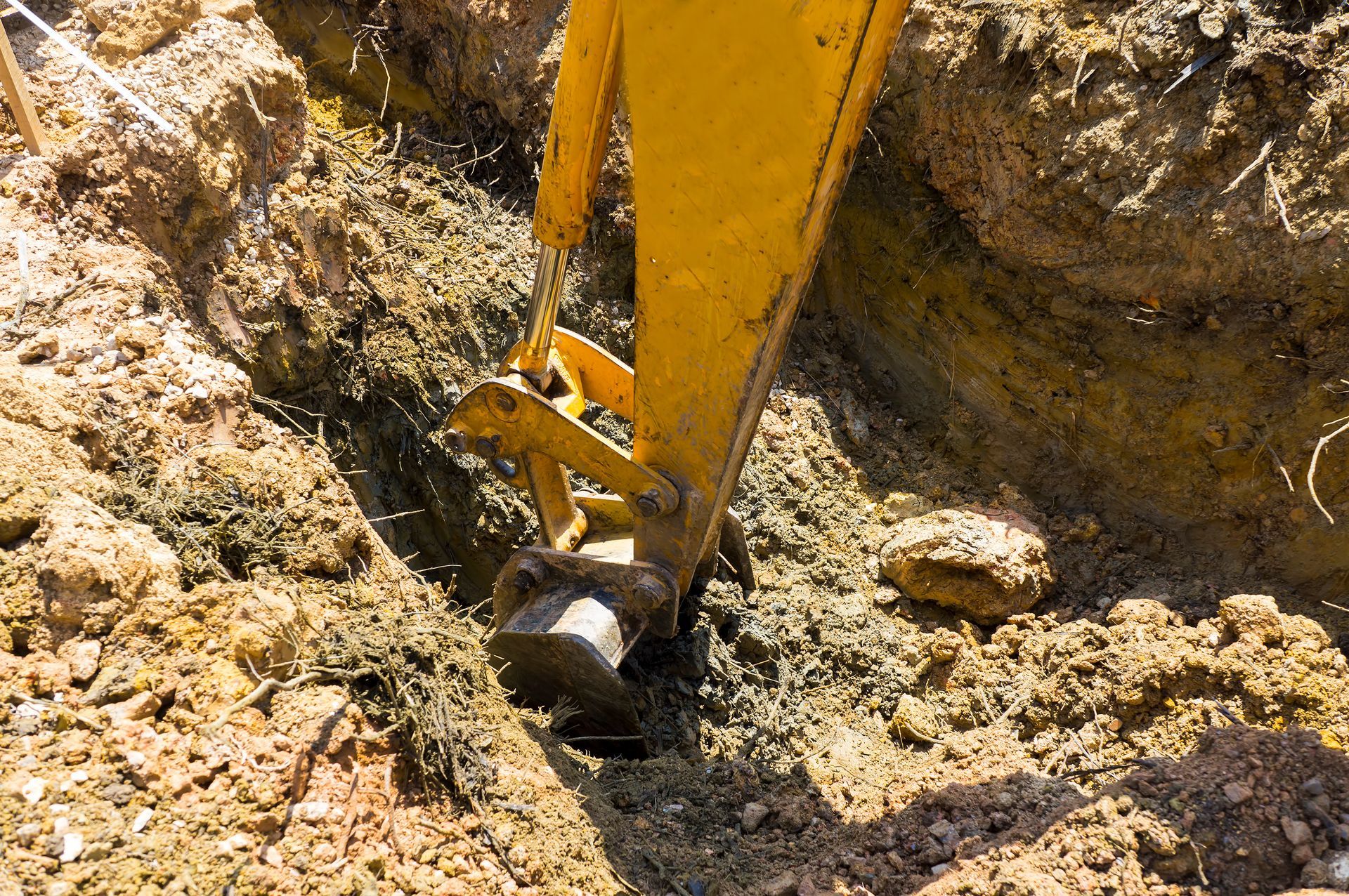 Excavating a hole to install a septic tank.