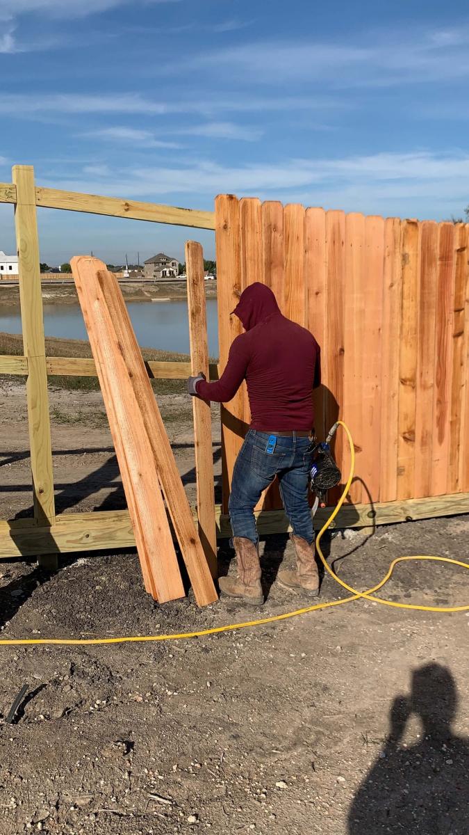 Man Installing Wood Fence — Pearland, TX — Fence Keeper