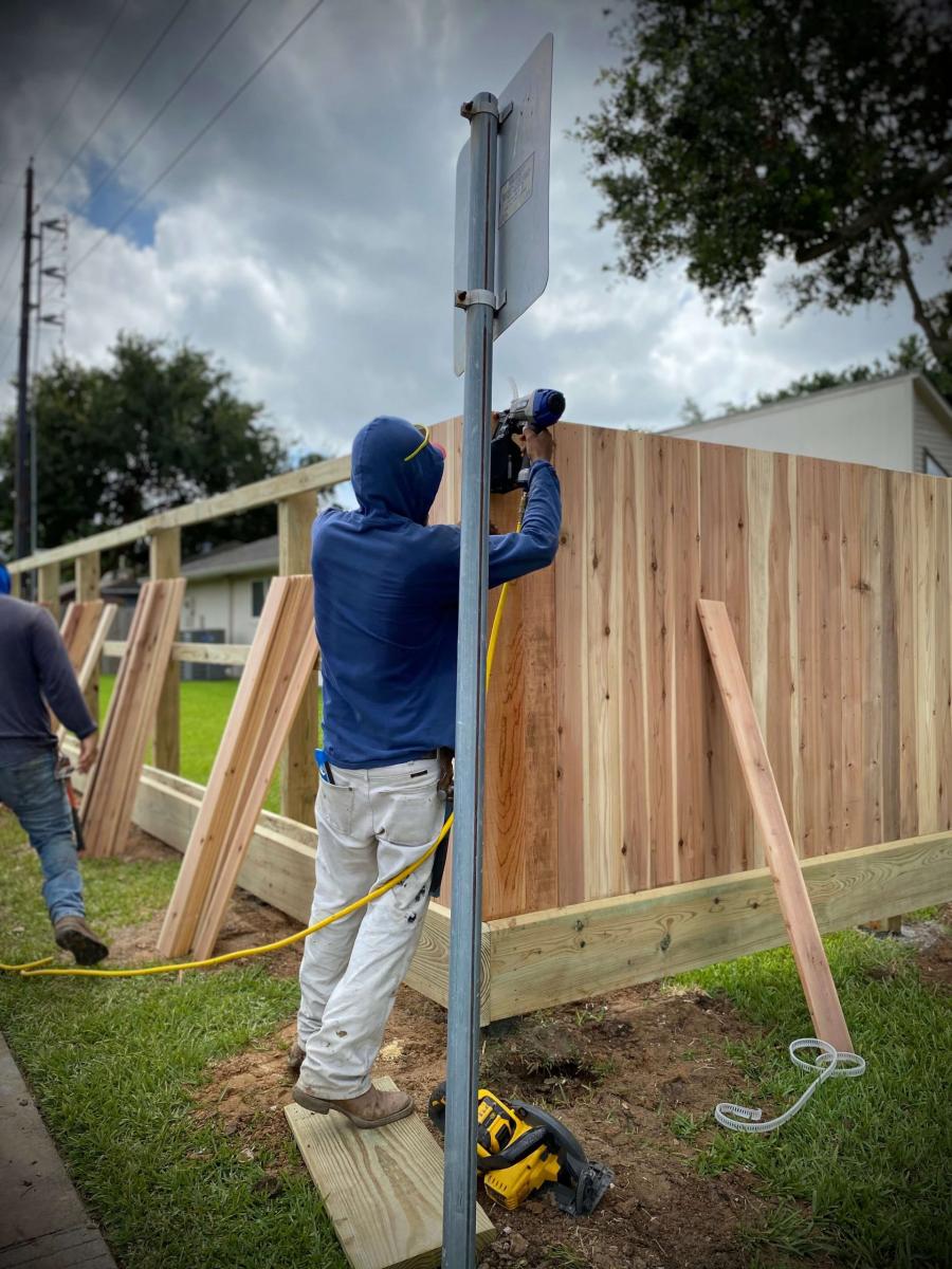 Man Working on Wood Fence Installation — Pearland, TX — Fence Keeper