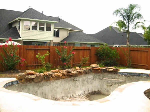 House with Wooden Backyard Fence — Pearland, TX — Fence Keeper