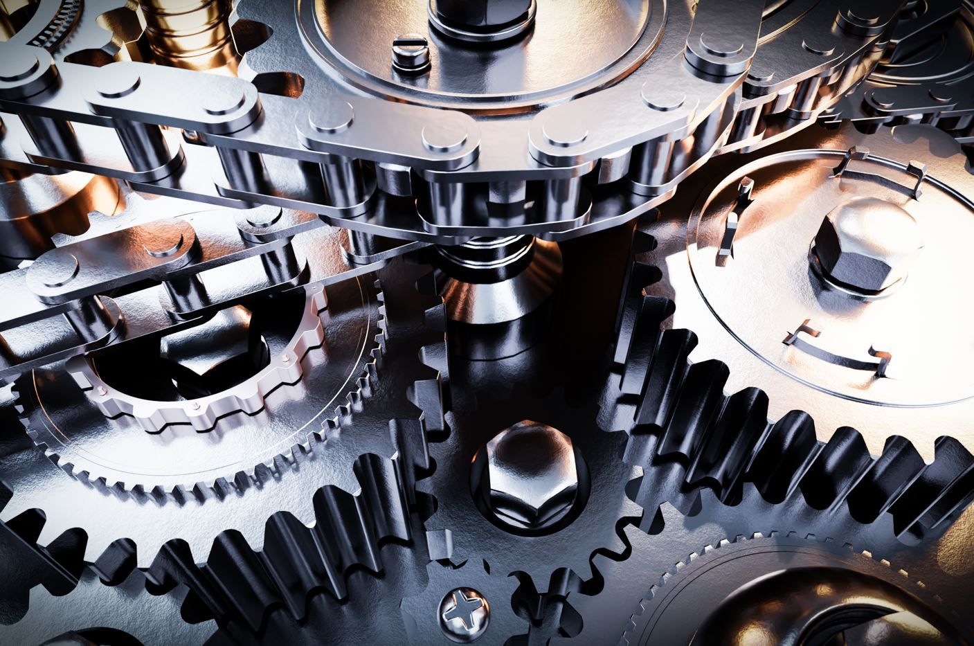 Close-up of interconnected shiny metal gears, a drive chain, and mechanical parts in a complex machine assembly.