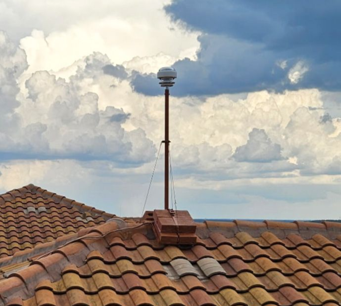 CMCE Lightning Suppression system installed on top of an apartment building with spanish tile roof