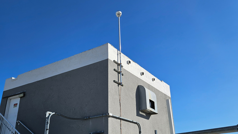 CMCE system mounted on the roof of a high-rise condo building