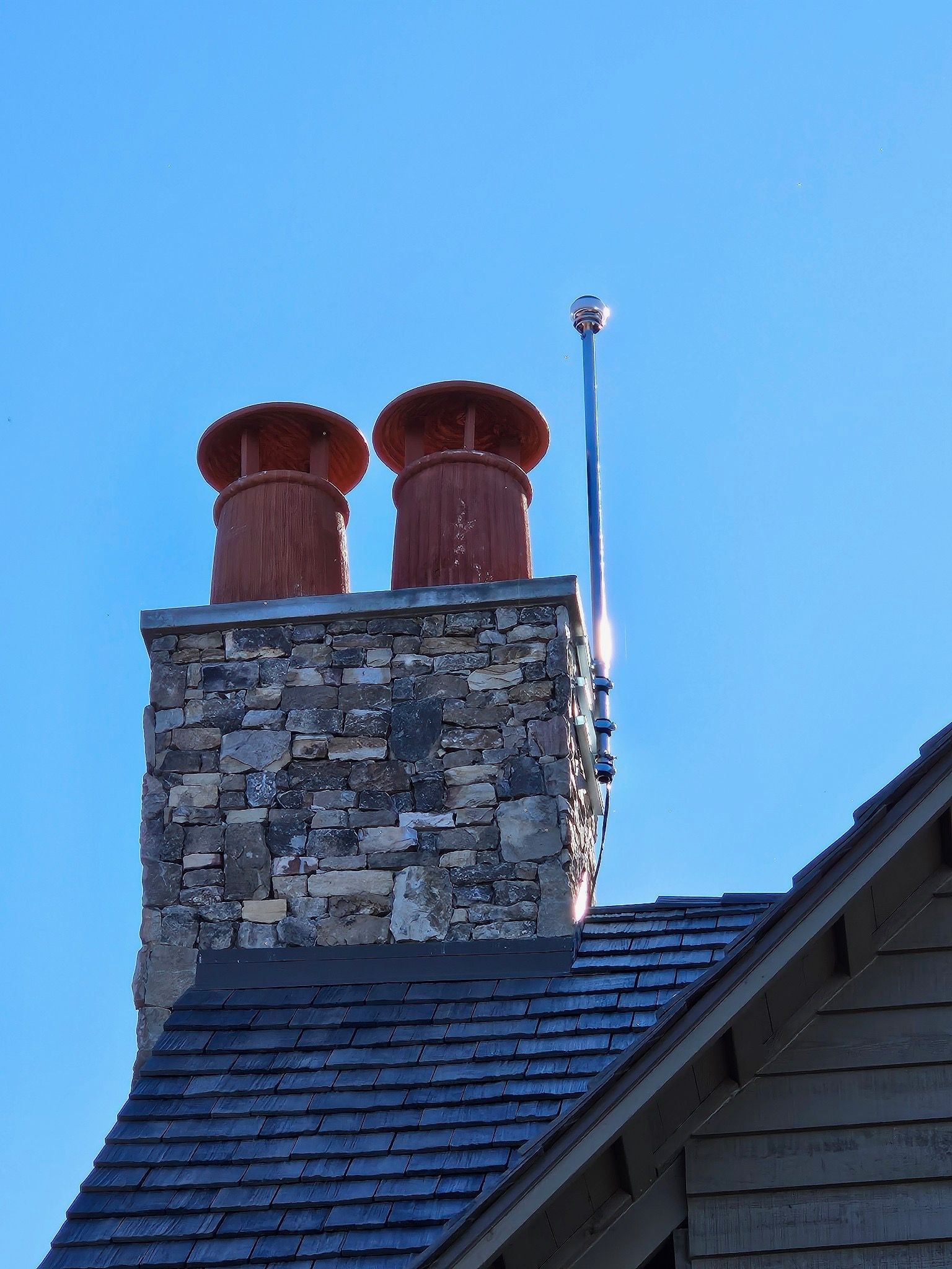 CMCE system mounted to the chimney on a luxury custom home