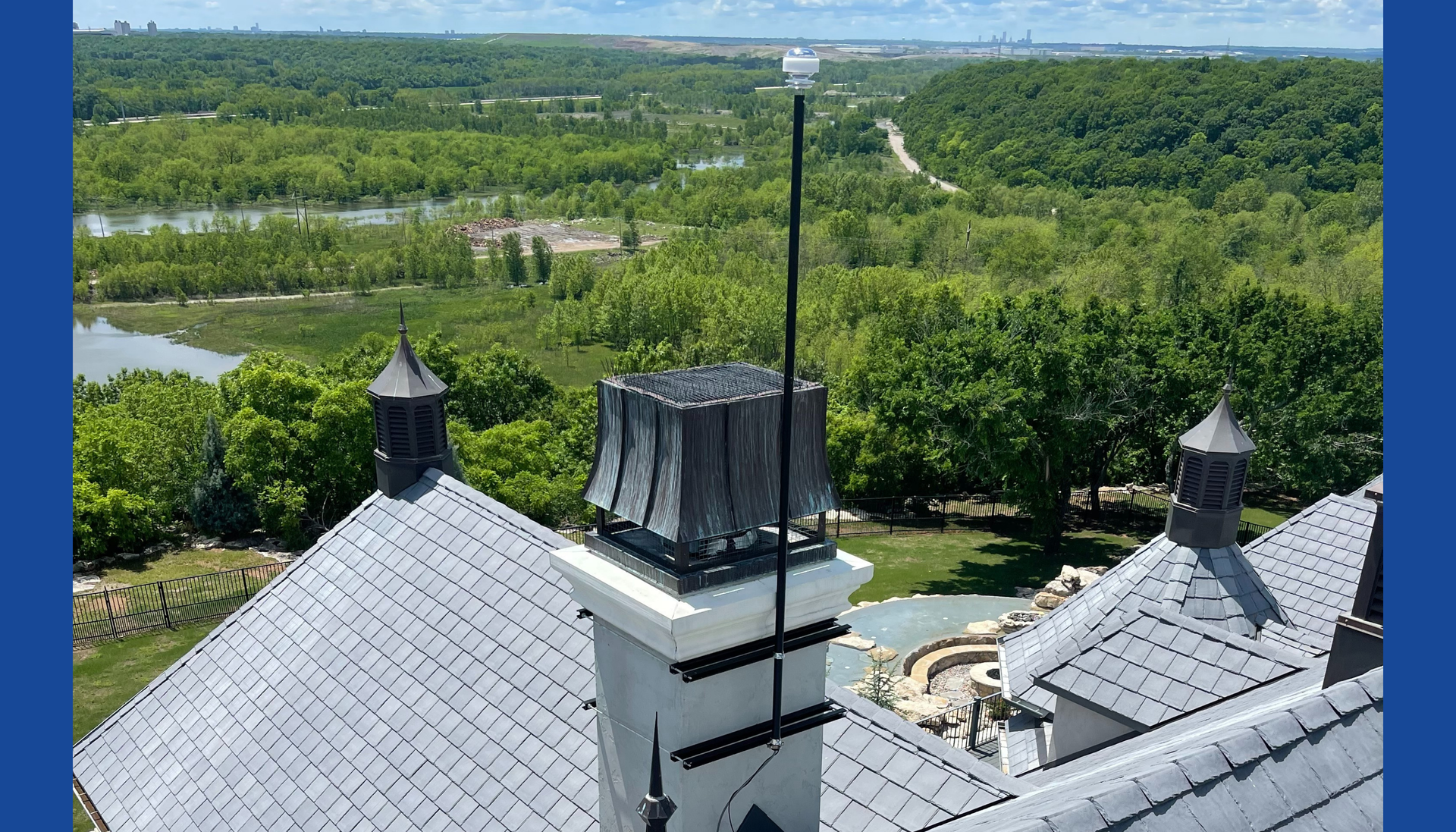 CMCE system mounted to the side of a chimney on a luxury home