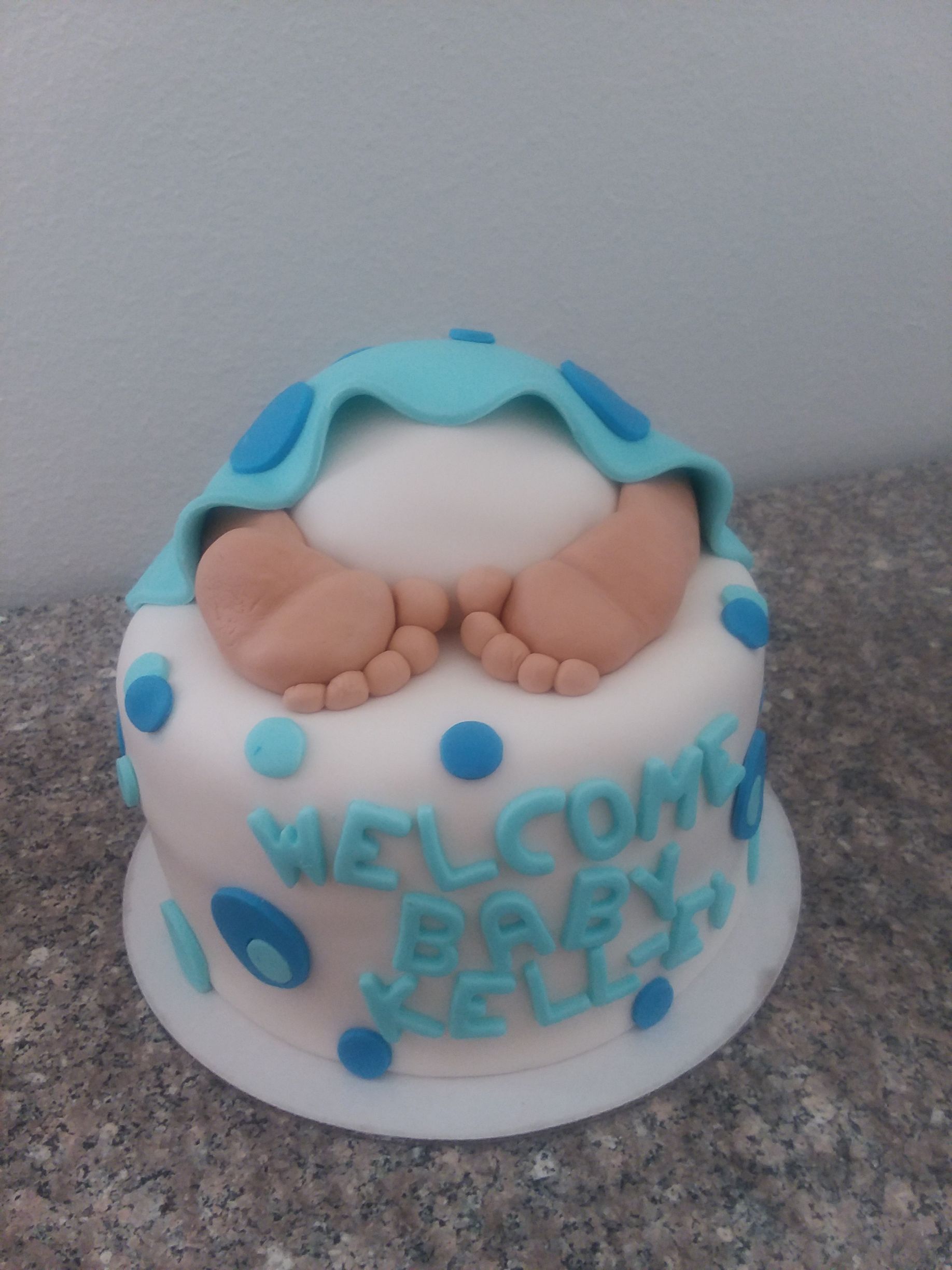 A baby shower cake that says welcome baby jesus on it