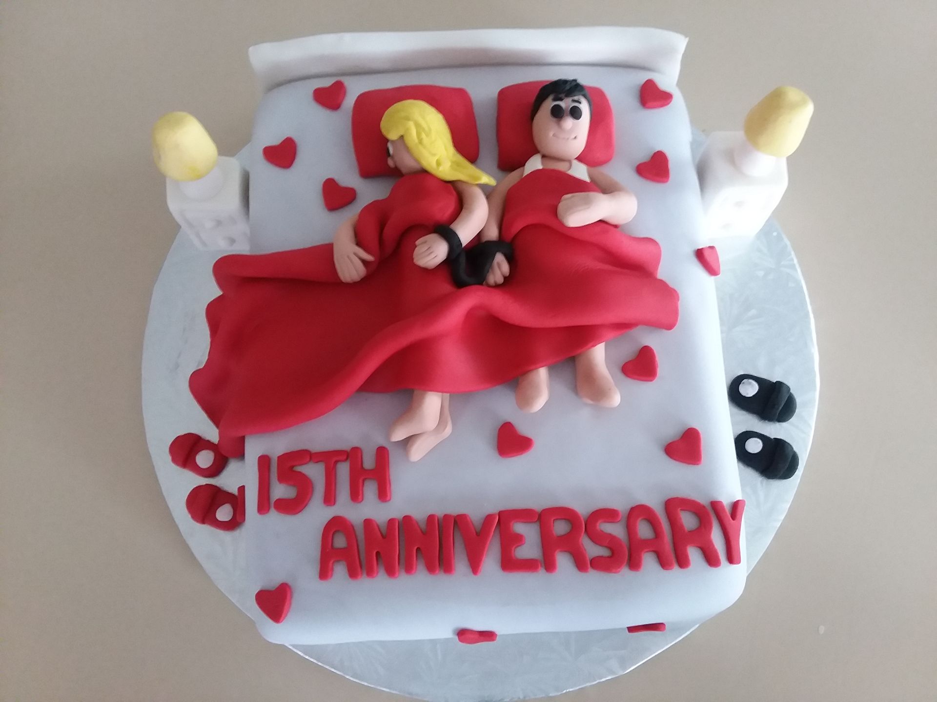 A cake that says 15th anniversary on it