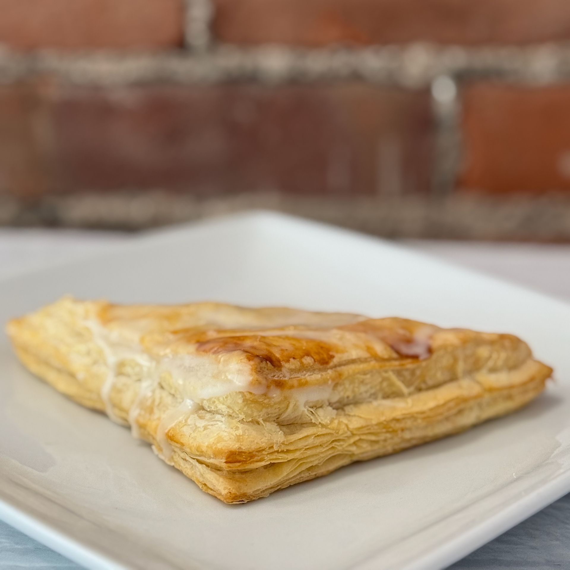 A close up of a pastry on a white plate.