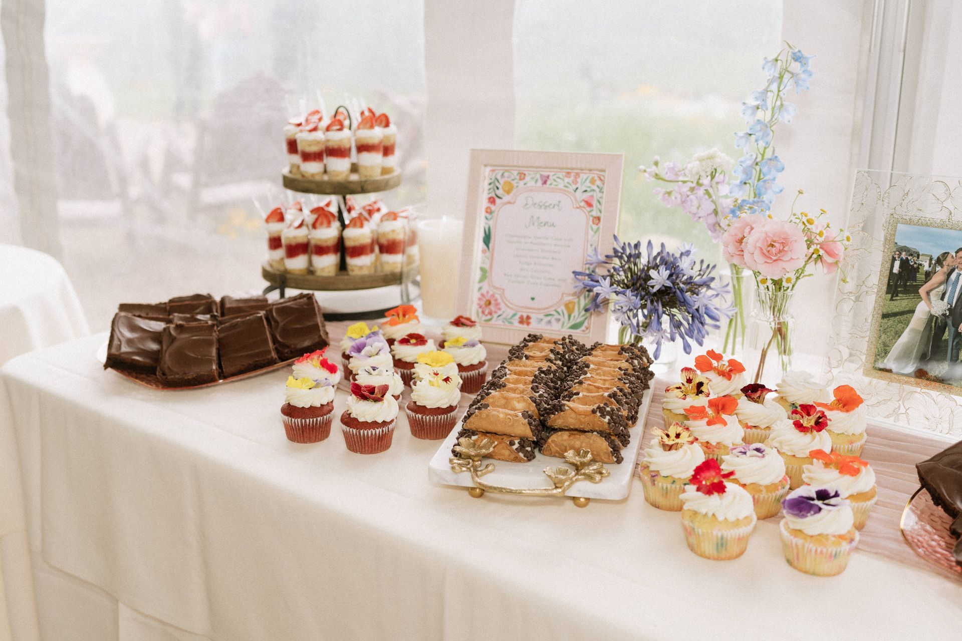 There are many different types of desserts on the table.