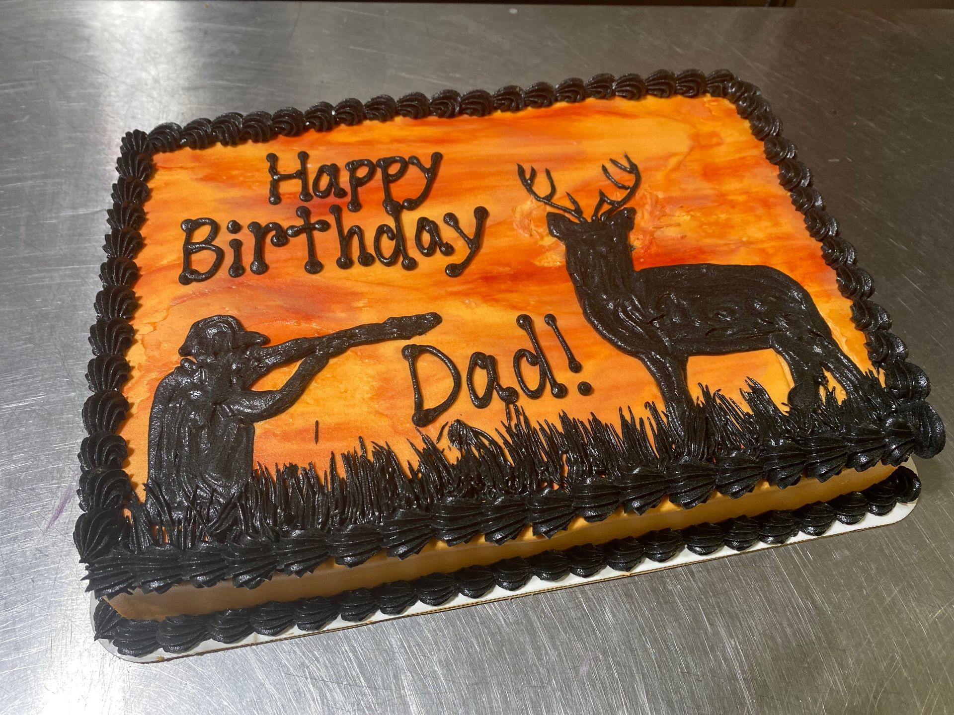 A birthday cake for a dad with a deer on it