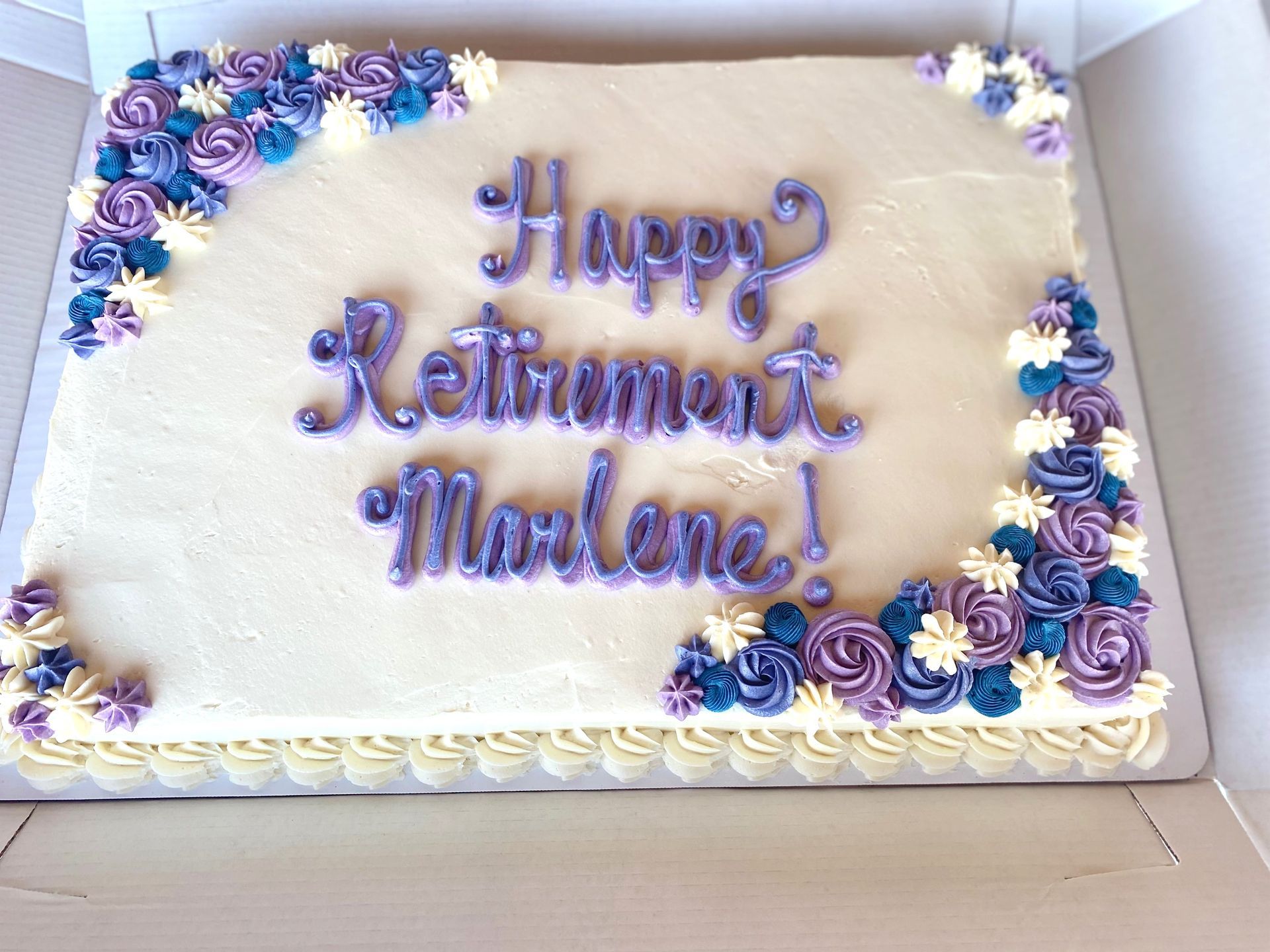 A cake that says happy retirement marlene on it