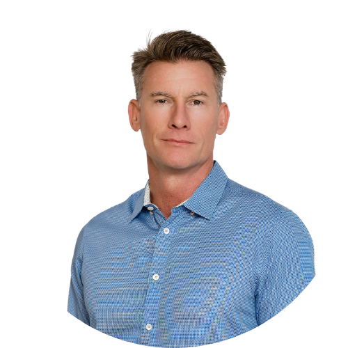 A man in a blue striped shirt is standing in front of a white background.