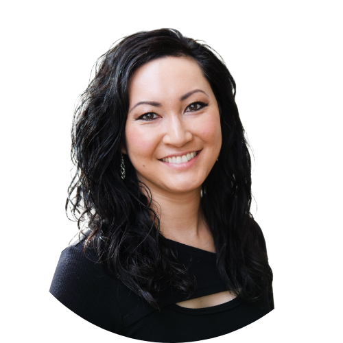 A woman with long dark hair is smiling and wearing a black shirt.