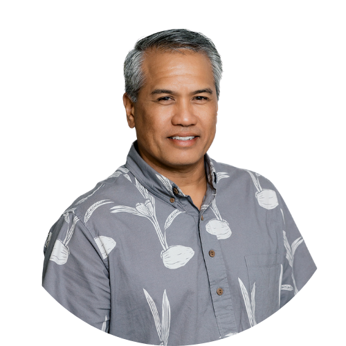 A man wearing a gray shirt with white flowers on it