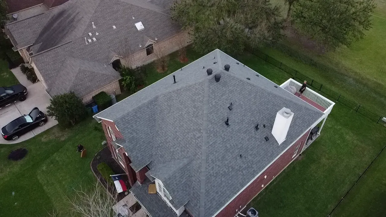 An aerial view of a house with a chimney on the roof.