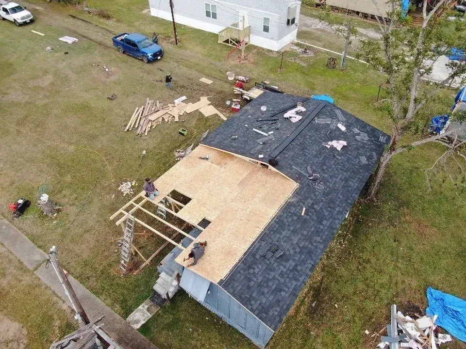 An aerial view of a house that has been damaged by a tornado.