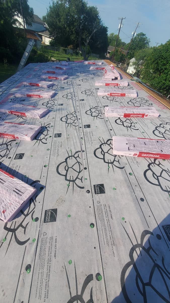 A roof with a lot of sheets of insulation on it.