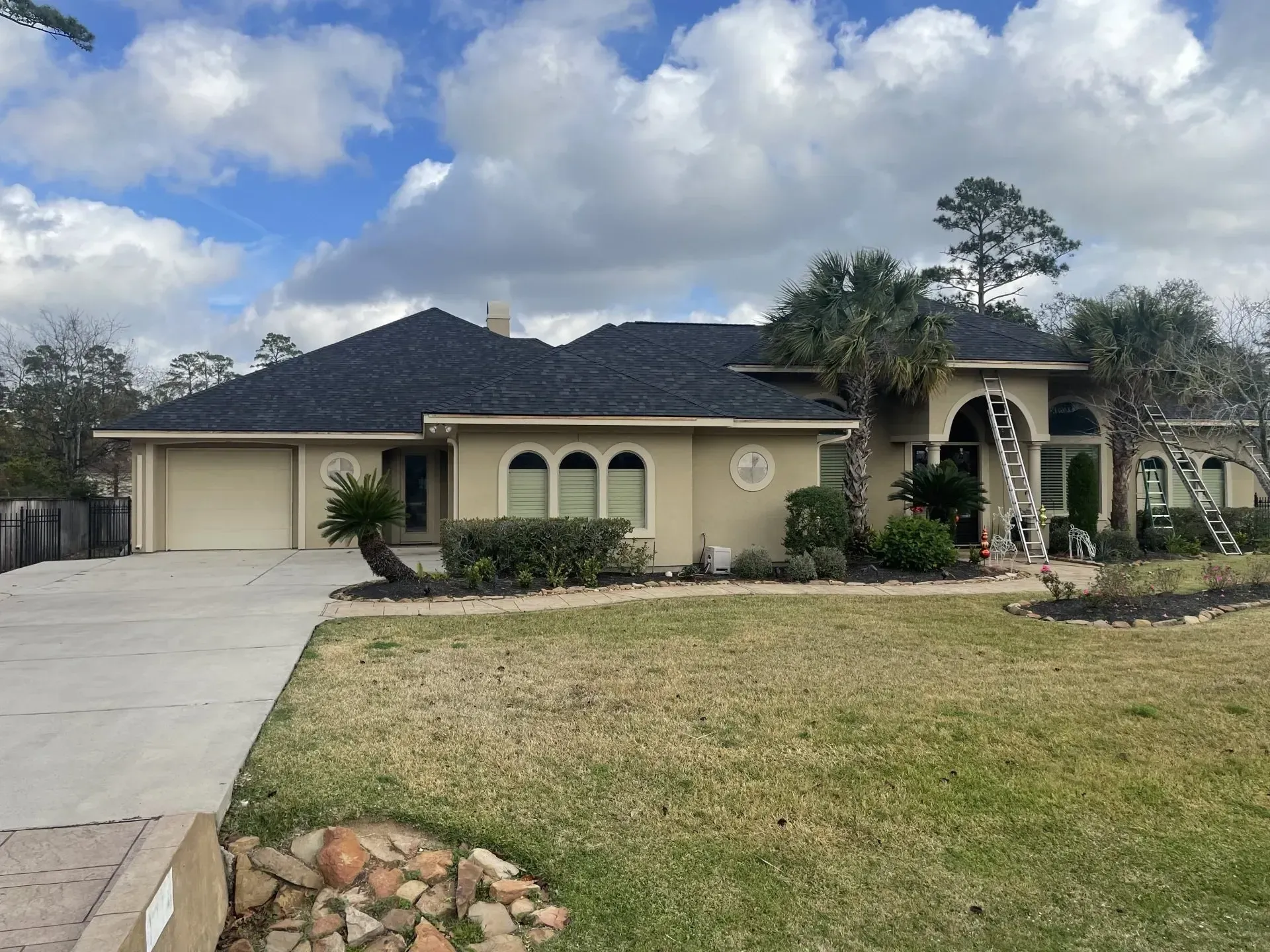 A large house with a ladder in front of it