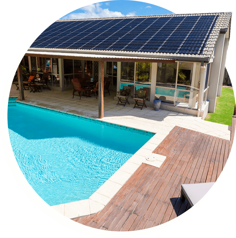 house with solar panels installed on roof and pool outside