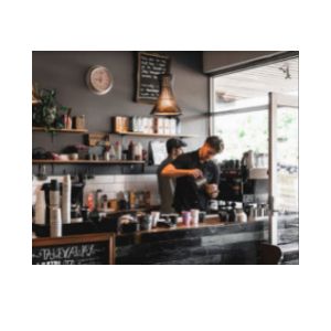 Image shows inside cafe Jack & Daisy with staff making coffee.