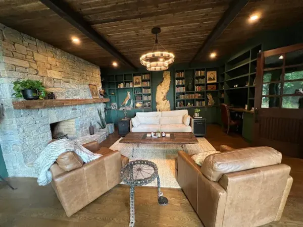 A bathroom with a walk in shower and a window.