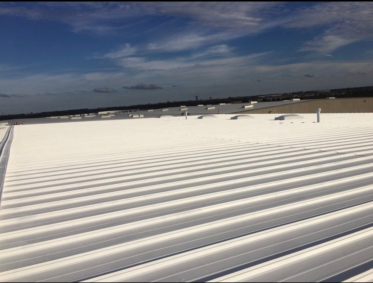 A white roof with a blue sky in the background