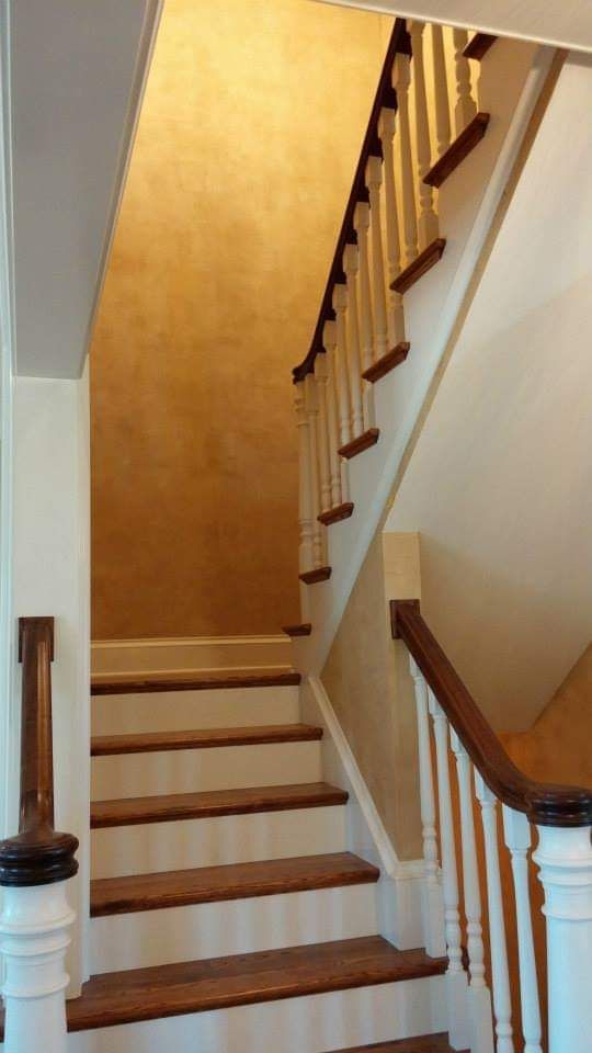 Decorative paint applied to walls in a stairway.