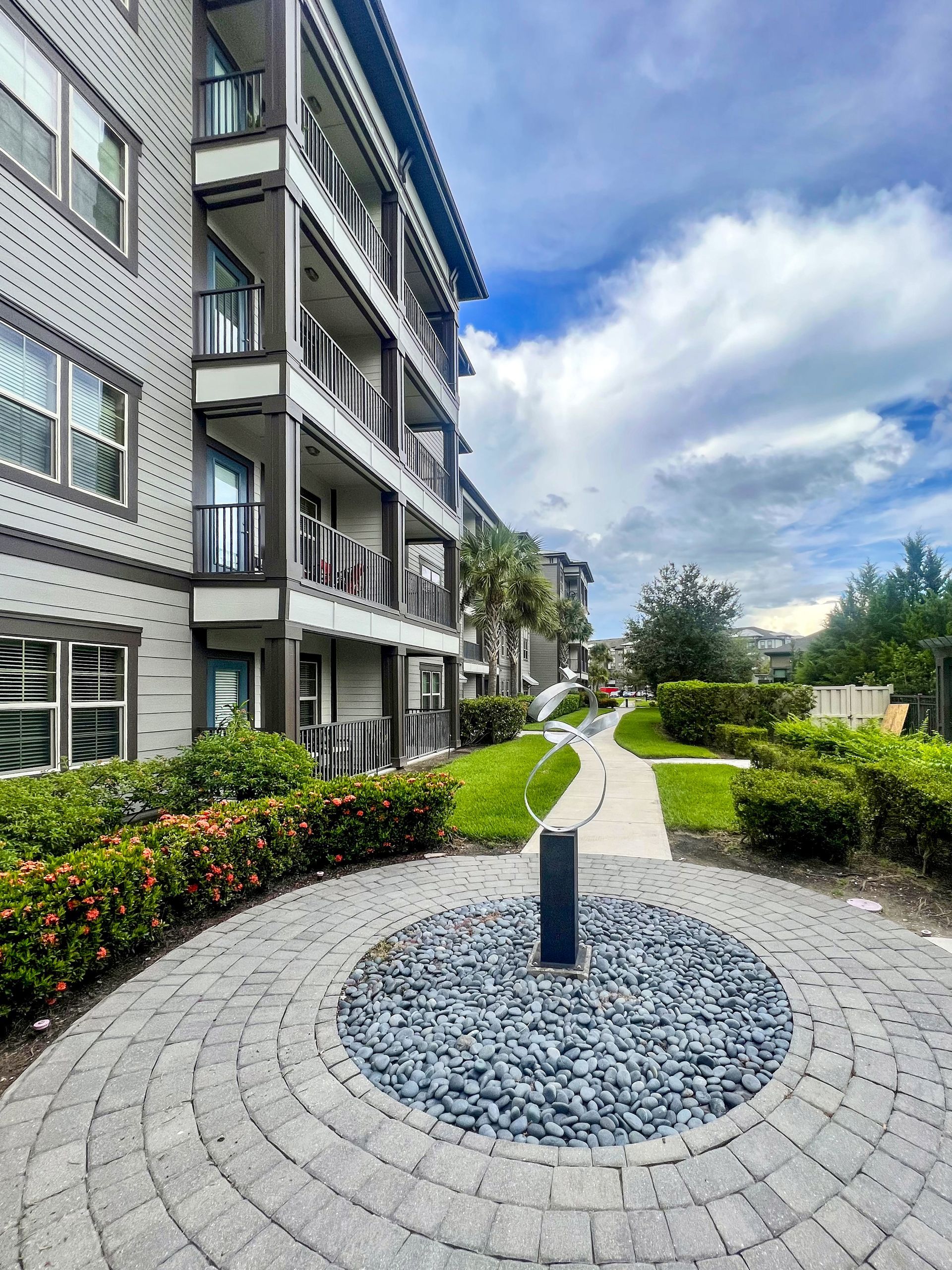 fountain and sidewalk outside of Creekside Ranch Apartments in Bradenton, FL