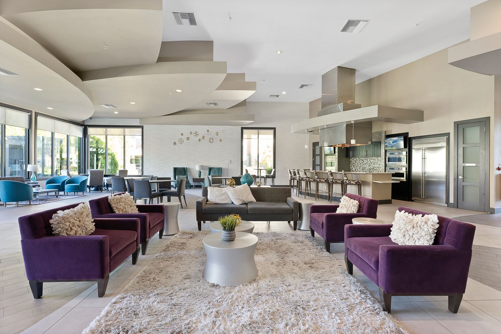 multiple seating areas in the Creekside Ranch Apartments clubroom