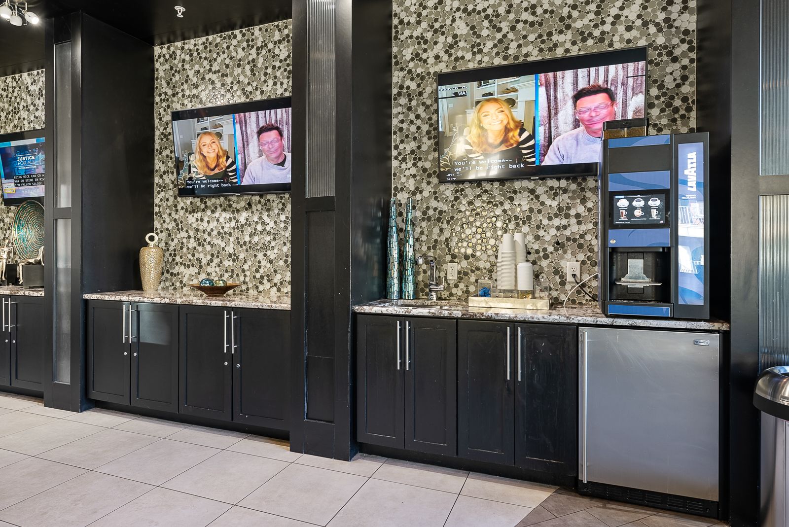 coffee bar and entertainment area in the Creekside Ranch Apartments clubhouse