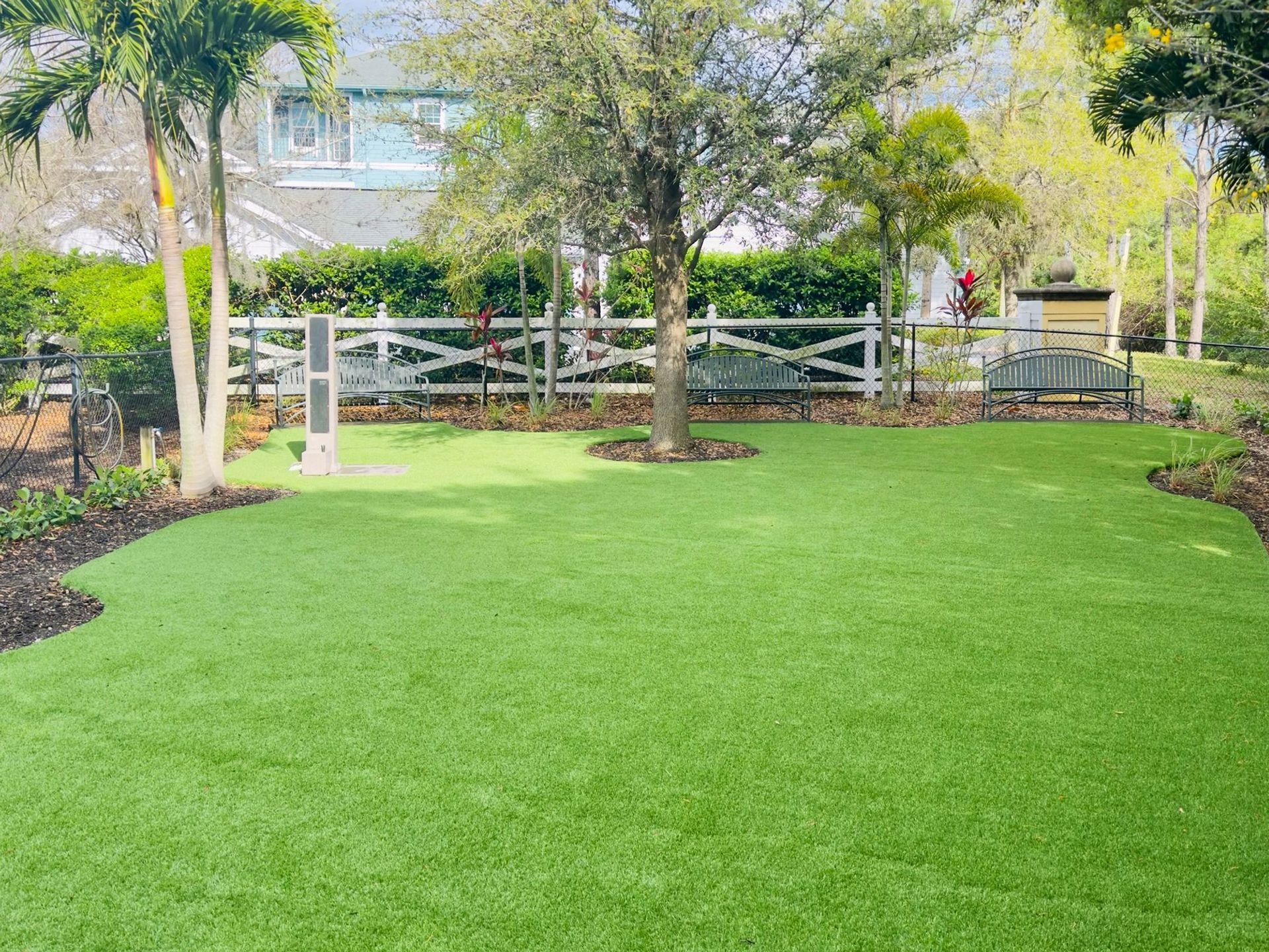 grassy fenced-in dog park on the Creekside Ranch Apartments property in Bradenton, FL