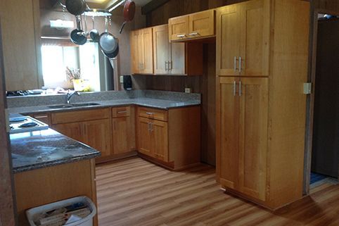 Kitchen With Wooden Cabinets — Waimanalo, HI — Mikey G Construction
