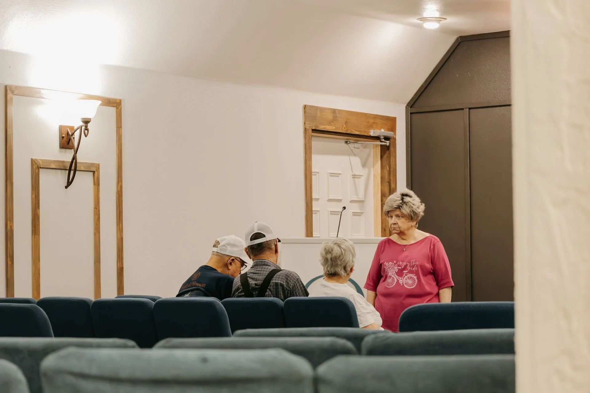 A group of people are sitting in a church.
