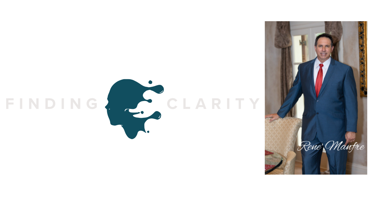 A man in a suit and tie is standing in front of a finding clarity logo