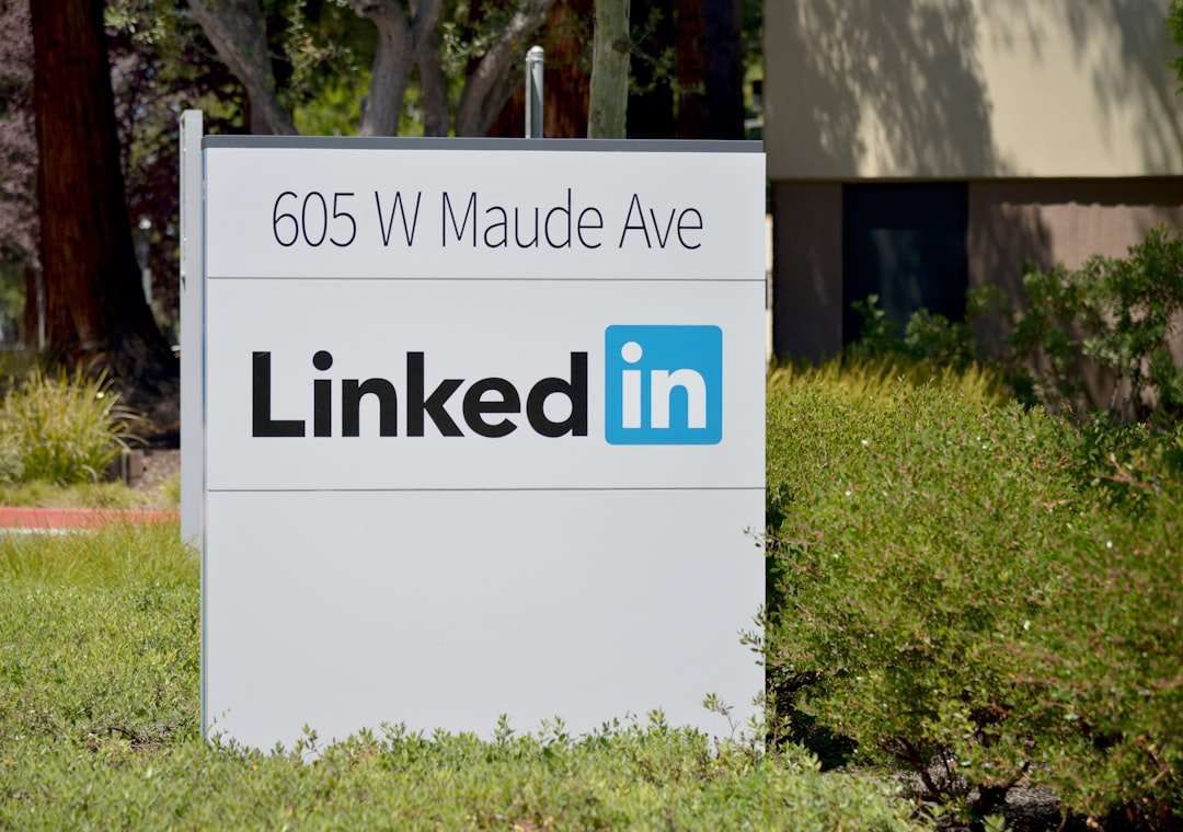 A sign for linkedin is in front of a building.