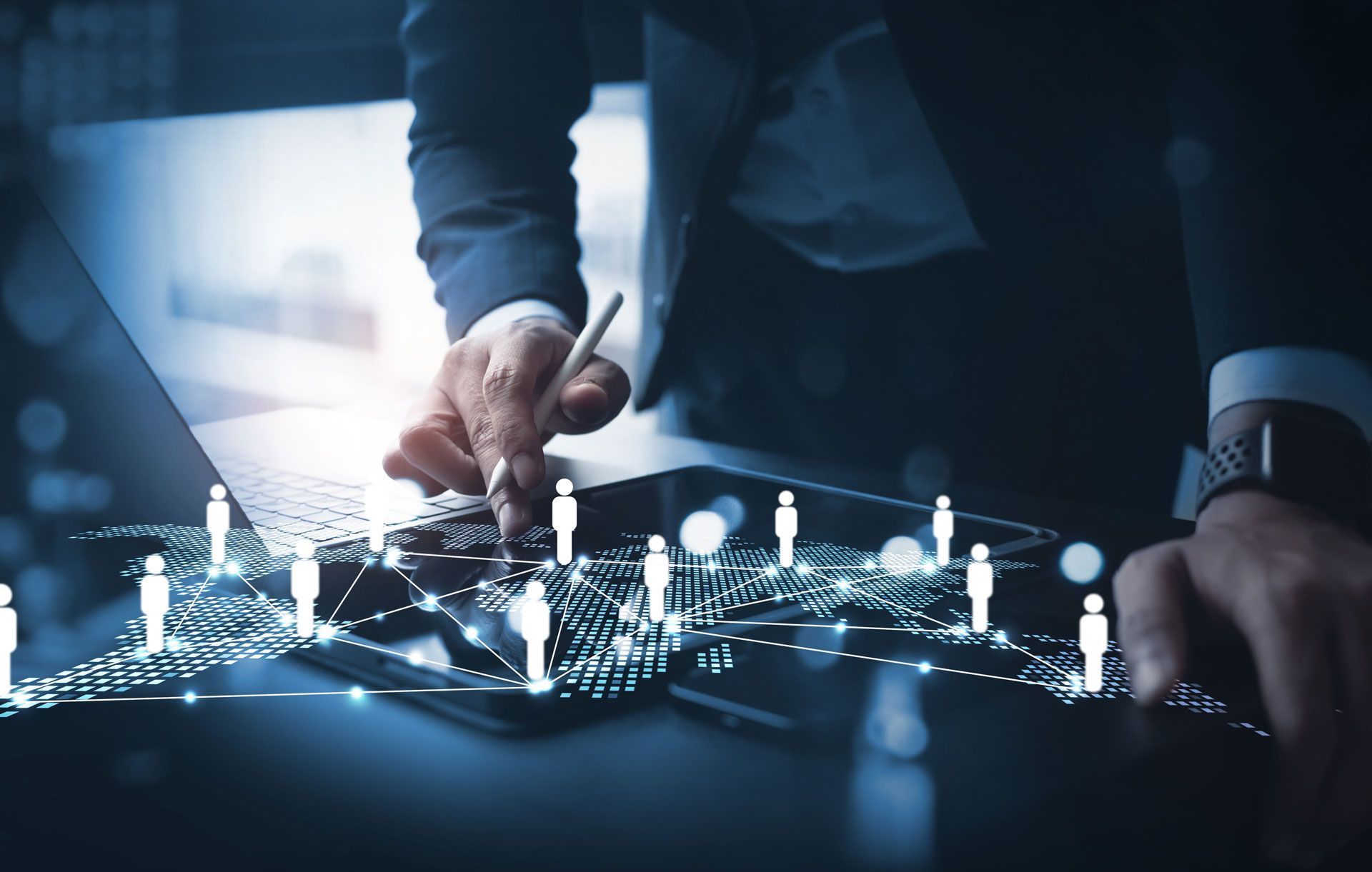 A person in a business suit uses a digital stylus on a tablet displaying a glowing, interconnected global data network.