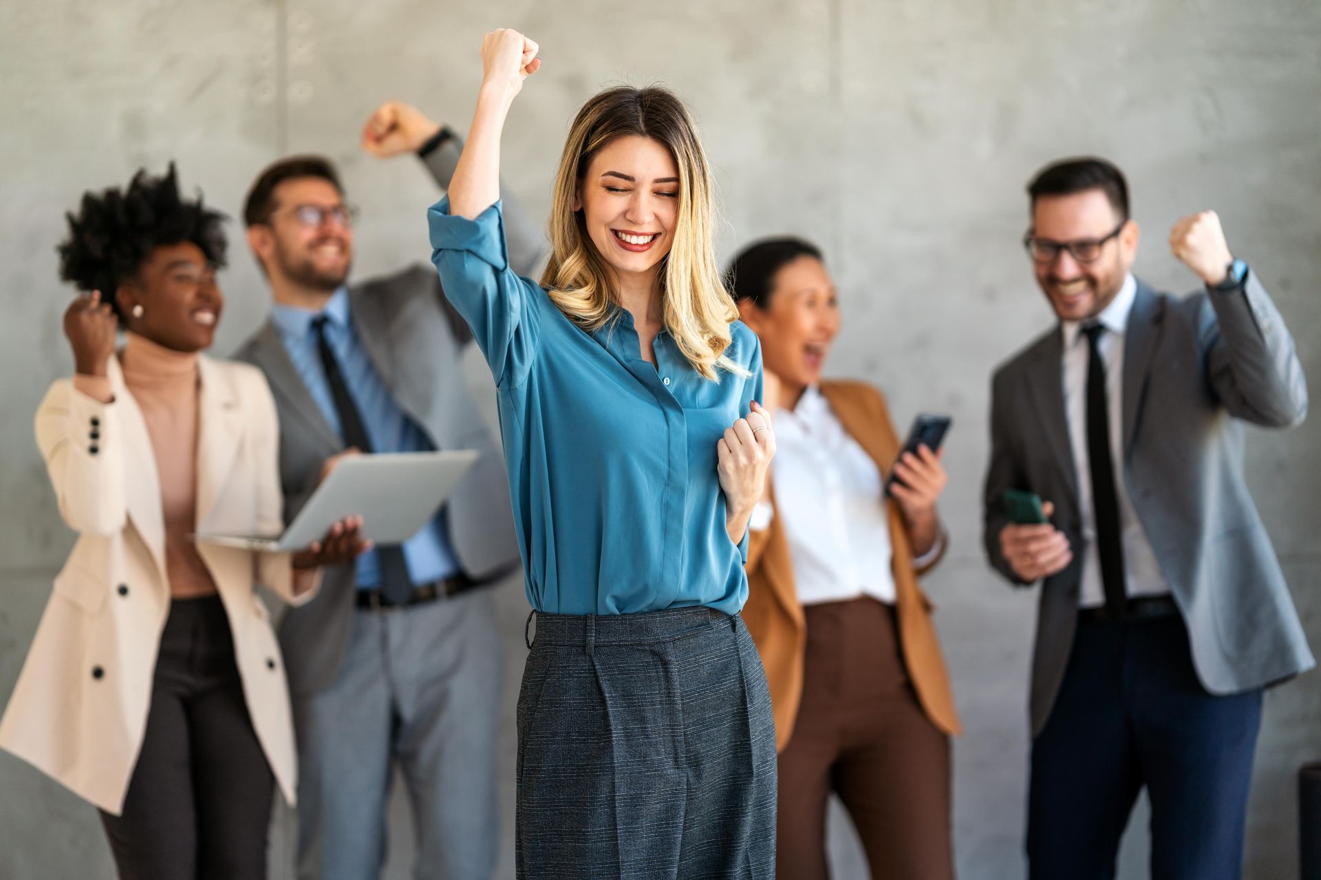 A group of people are standing in a room with the words `` business networking group '' written above them.