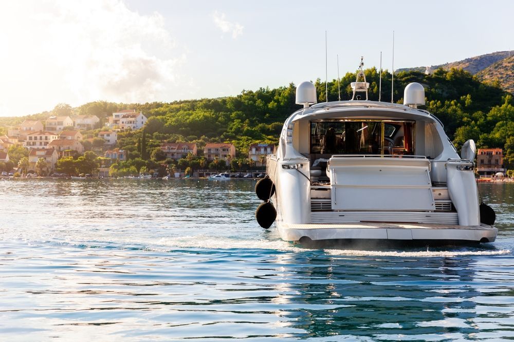 A yacht is floating on top of a body of water.