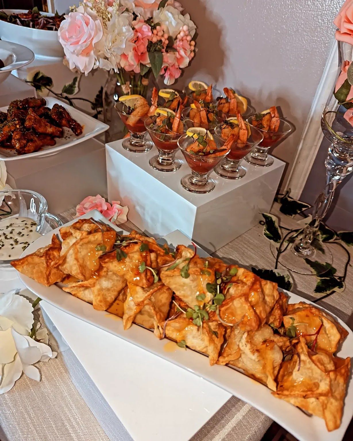 A table topped with plates of food and drinks.