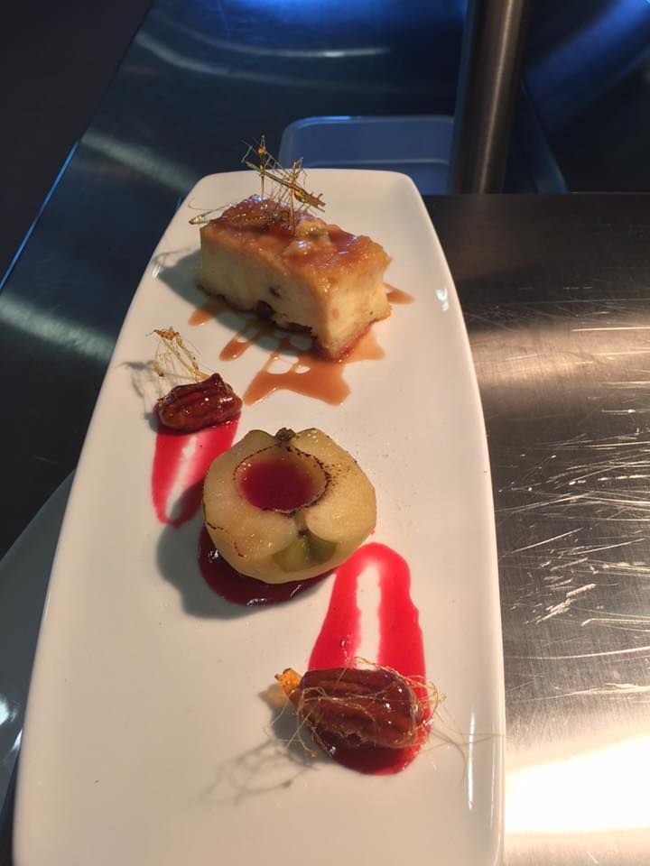 A white plate with a piece of cake on it