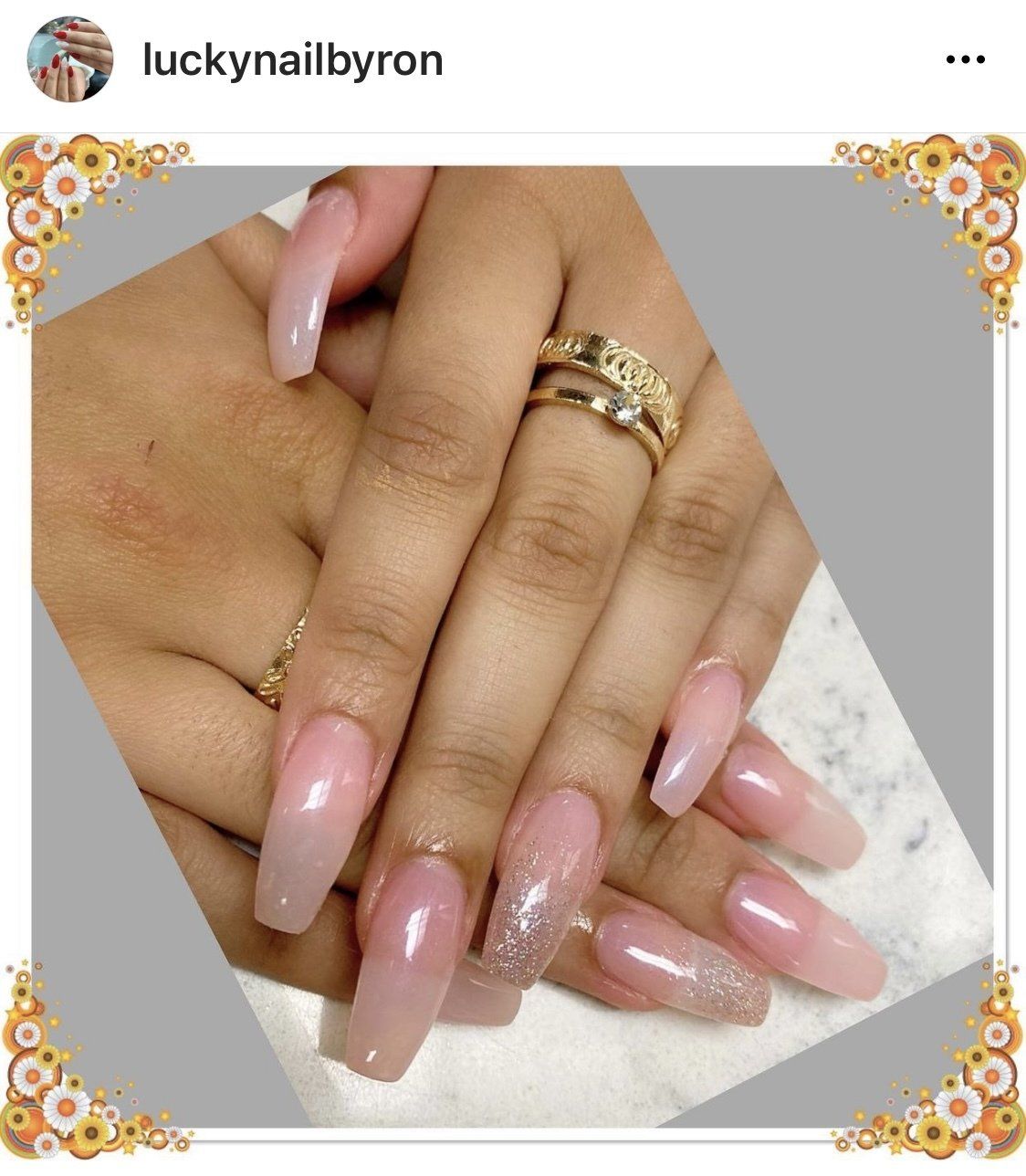 Manicured hands with long, light pink nails, glitter accent nail.