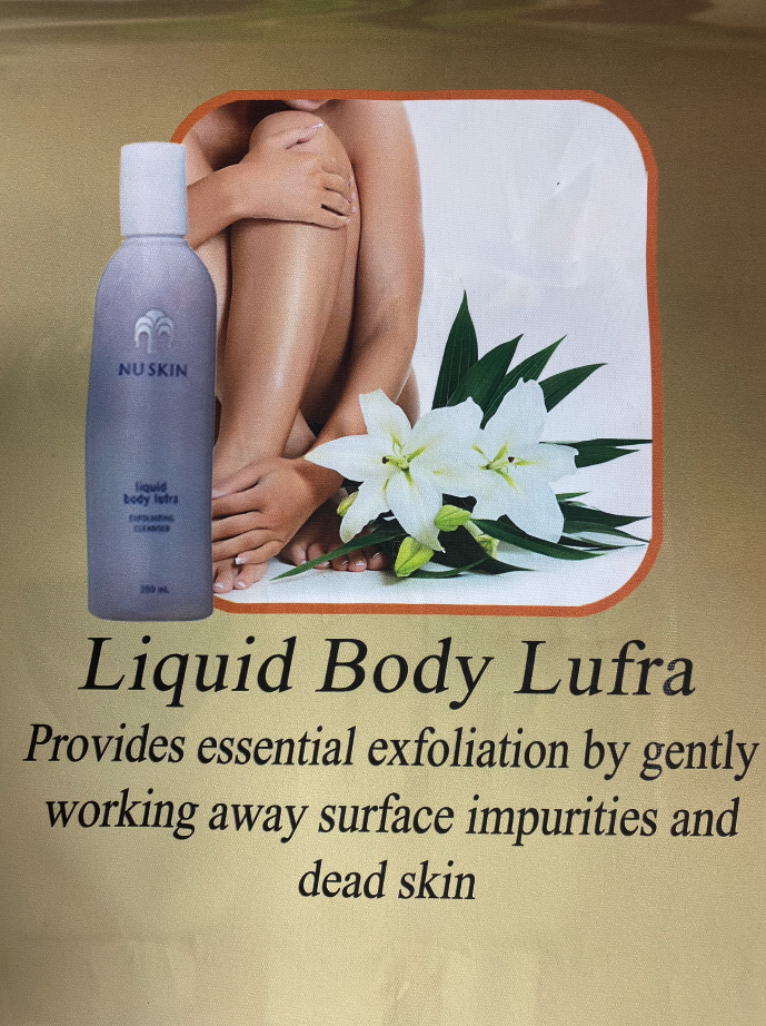 Bottle of Nu Skin Liquid Body Lufra, next to a person’s legs and lily flowers, promising exfoliation.