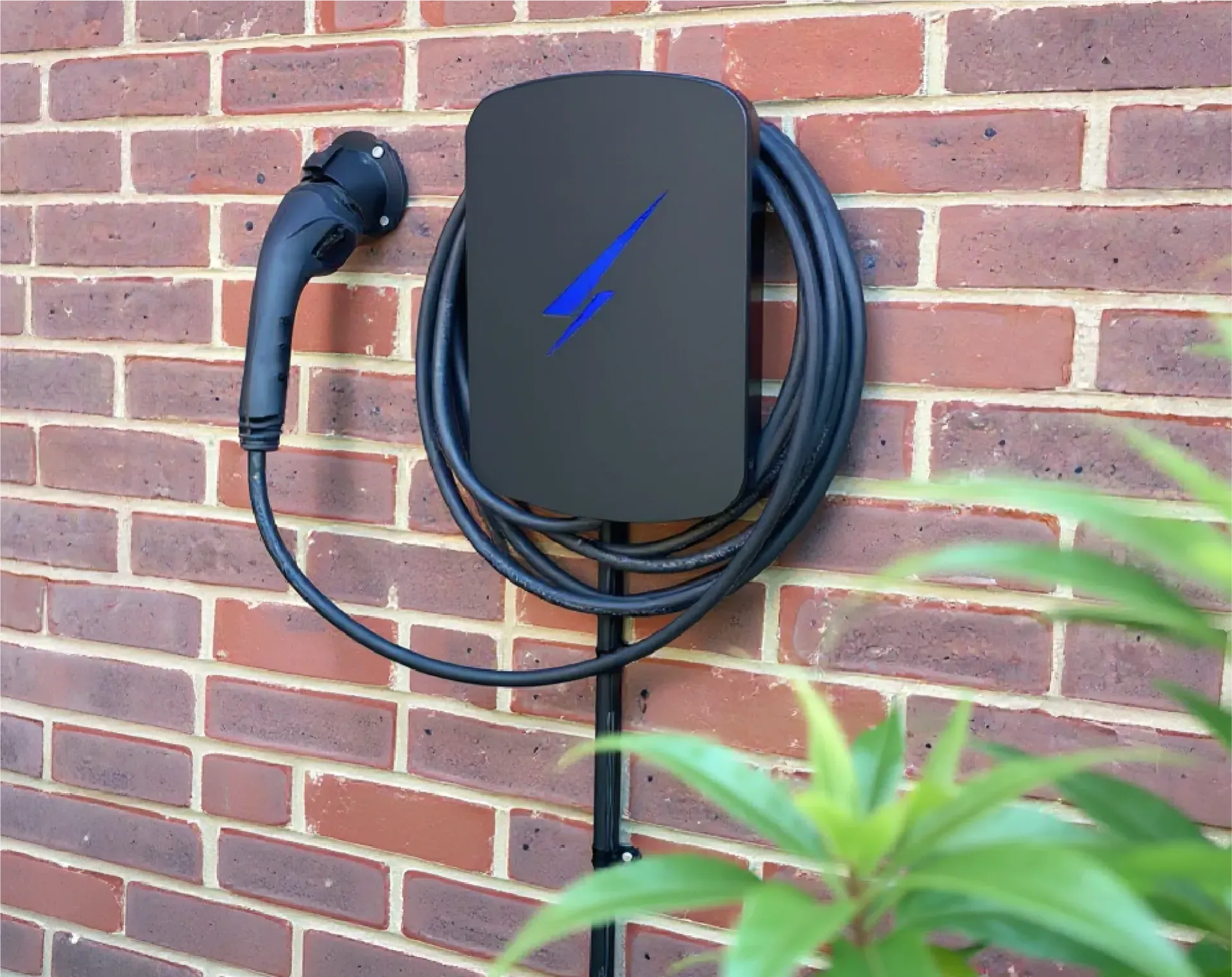 A person is charging an electric car with a charger.