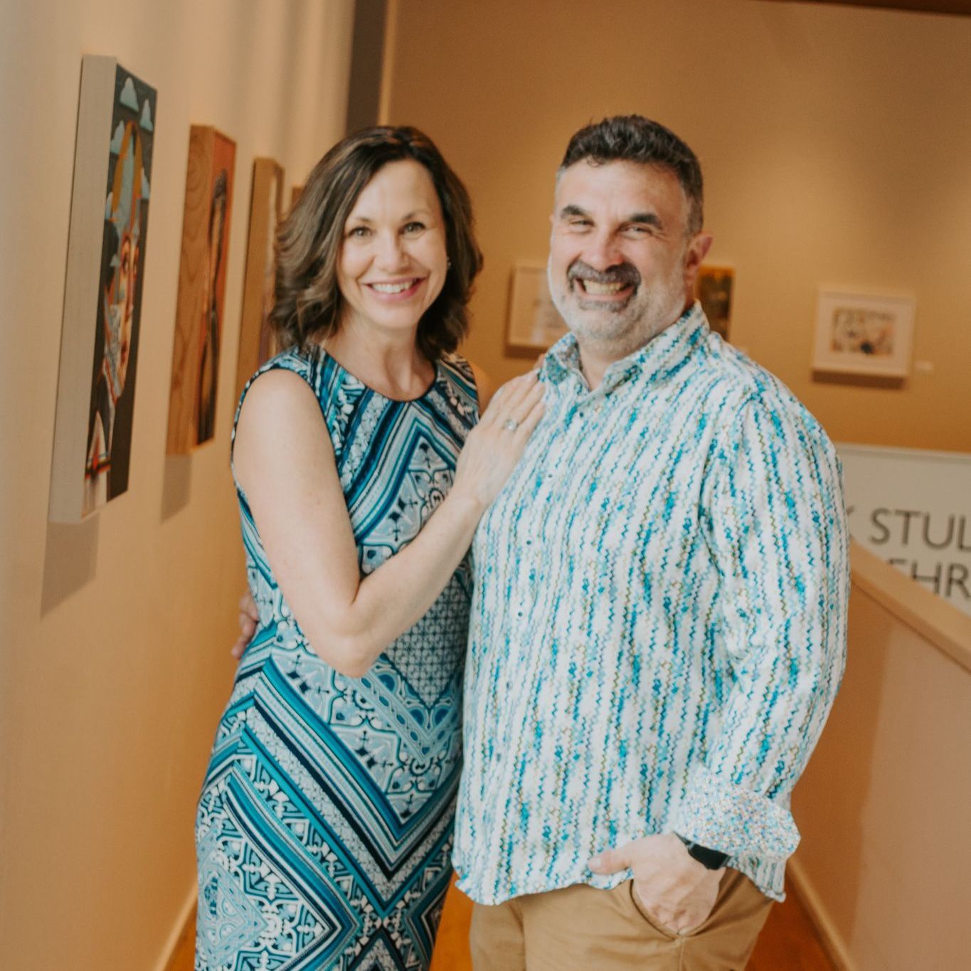 A Man and Woman standing together smiling