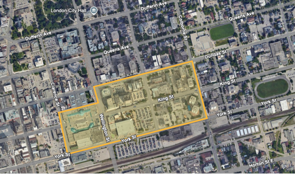 An aerial view of a city with a yellow outline around the buildings.